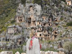 Woman explores site of ancient Greek ruin, Myra