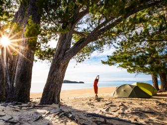 Campground at Apple Tree Bay in Abel Tasman National Park, New Zealand.