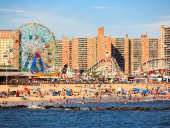 New York, NY, USA - August 30, 2016: Beach in Coney Island: People enjoy beach: Coney Island is a peninsular residential neighborhood, beach, and leisure/entertainment.